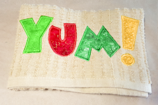 Yum Applique: A Sweet Embroidery Design for Handmade Gifts